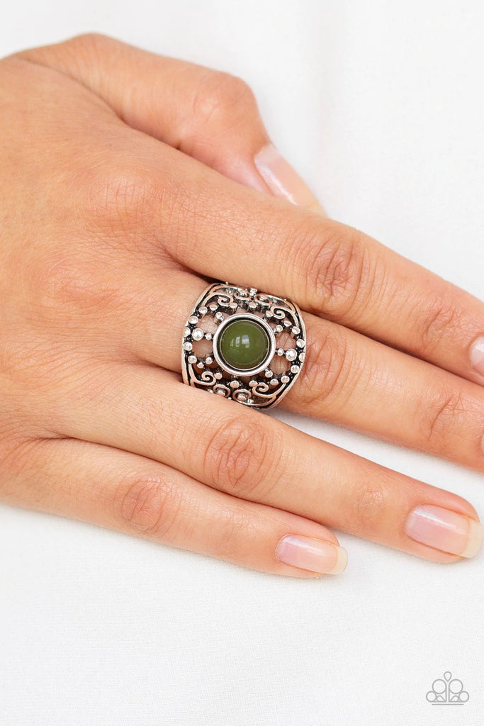 A refreshing green bead is pressed into a shimmery silver frame swirling with studded filigree, creating a colorful centerpiece atop the finger. Features a stretchy band for a flexible fit.  Sold as one individual ring.