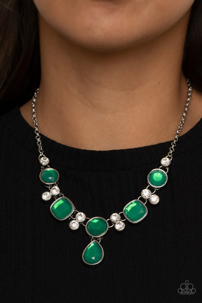 Pairs of glittery white rhinestones, join a sparkly collection of round, square, and dewy teardrop green rhinestones below the collar for a timeless look. Features an adjustable clasp closure.  Sold as one individual necklace. Includes one pair of matching earrings.