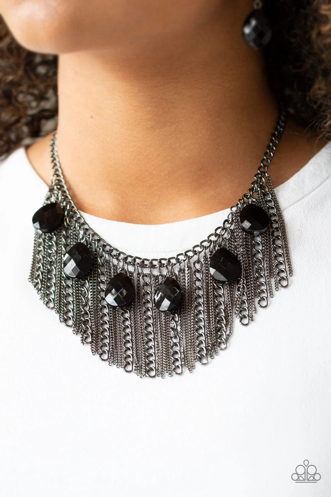 Infused with a row of faceted black teardrops, mismatched strands of gunmetal chains stream from the bottom of a glistening gunmetal chain, creating a statement-making fringe below the collar. Features an adjustable clasp closure.  You don’t need to break the bank to accessorize your wardrobe!  Its amazing how much 2 or 3 pieces of jewelry can change the look of an outfit.  Sold as one individual necklace. Includes one pair of matching earrings.