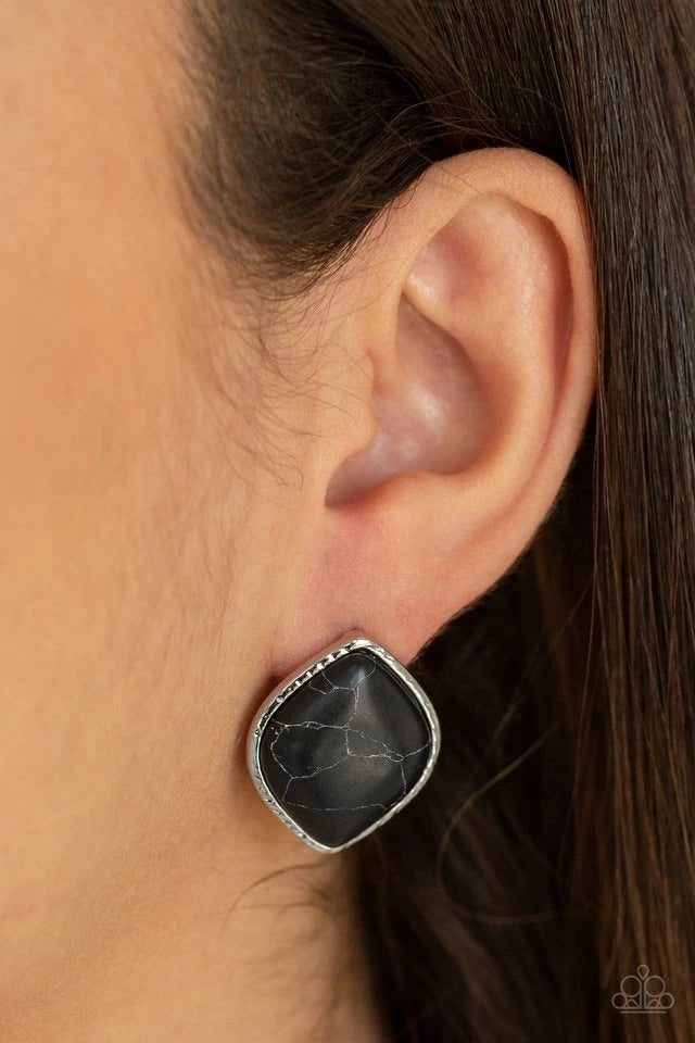 Featuring a faux marble finish, a smooth black stone is nestled inside a textured silver frame for a casual look. Earring attaches to a standard post fitting.  Sold as one pair of post earrings.