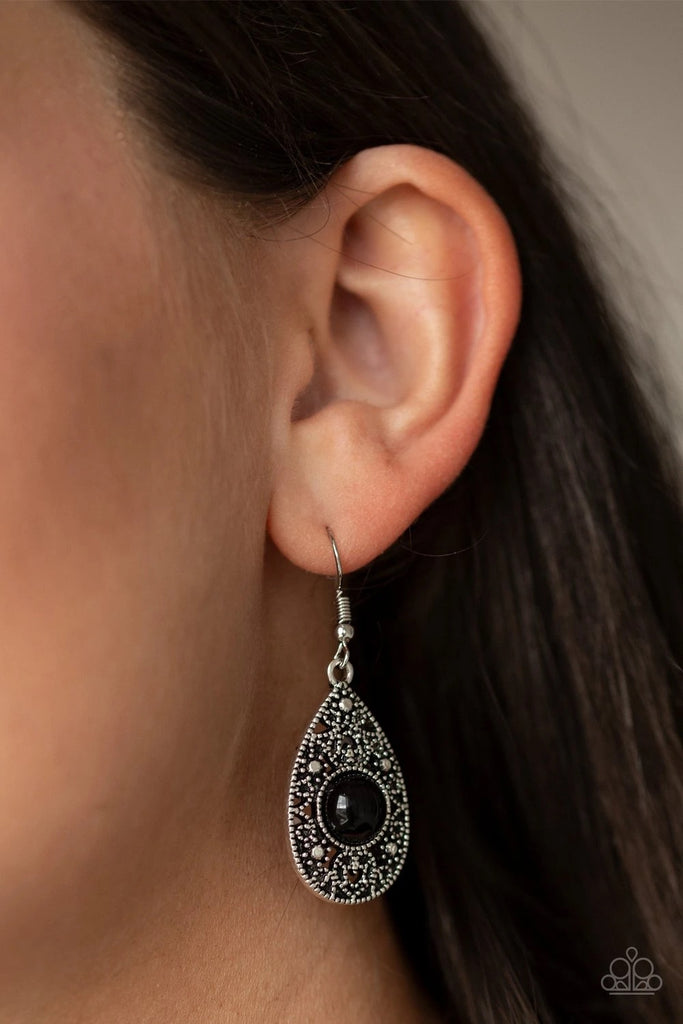 A shiny black bead is pressed into the center of a silver studded teardrop frame for a perfect pop of color. Earring attaches to a standard fishhook fitting.  Sold as one pair of earrings.