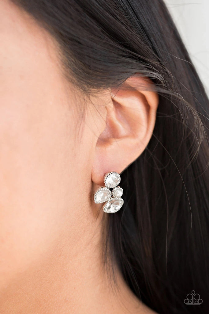 Infused with a dainty white pearl, mismatched white rhinestones coalesce into a glittery frame. Earring attaches to a standard post fitting.  Sold as one pair of post earrings.