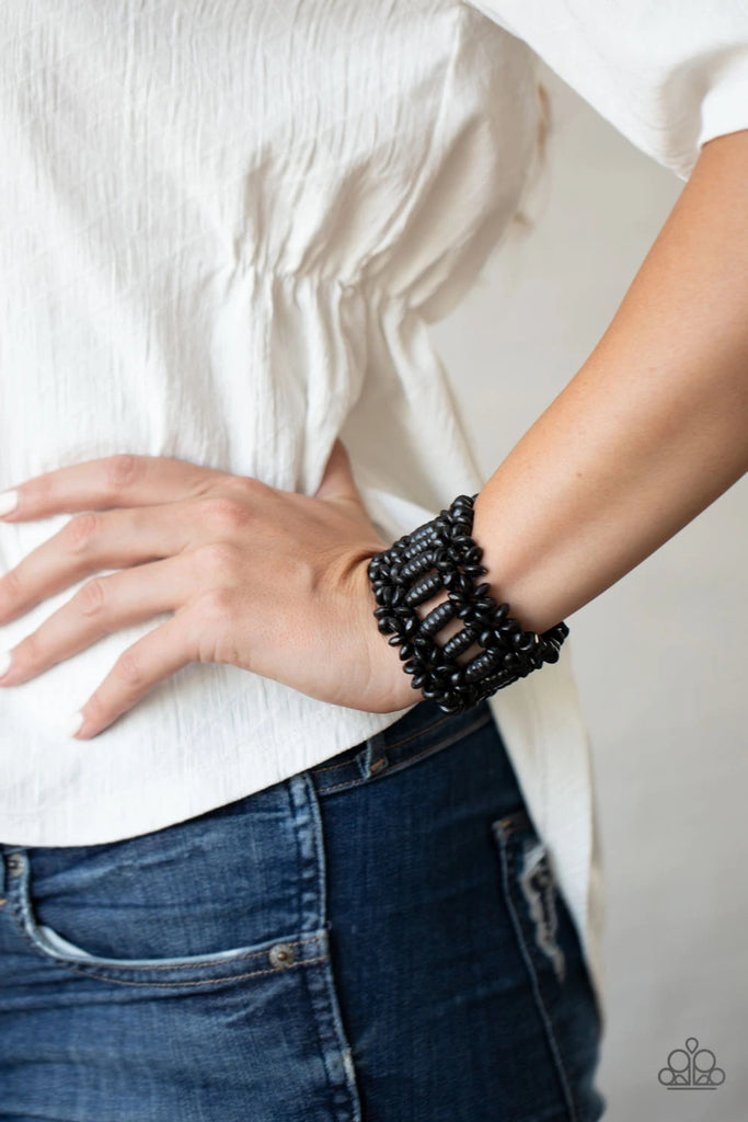 Painted in a shiny black finish, round and oval wooden beads are threaded along stretchy bands that weave into a colorful floral patterned stretch bracelet around the wrist.  Sold as one individual bracelet.