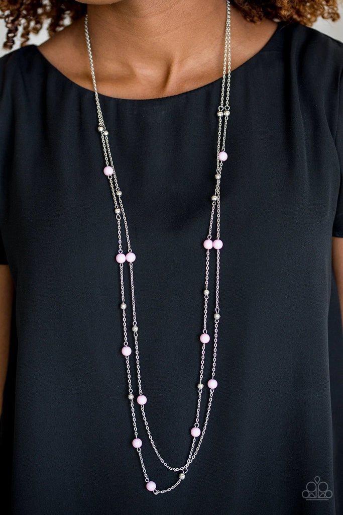 Pretty pink and dainty silver beads trickle along two shimmery silver chains, creating colorful layers down the chest. Features an adjustable clasp closure.  Sold as one individual necklace. Includes one pair of matching earrings.