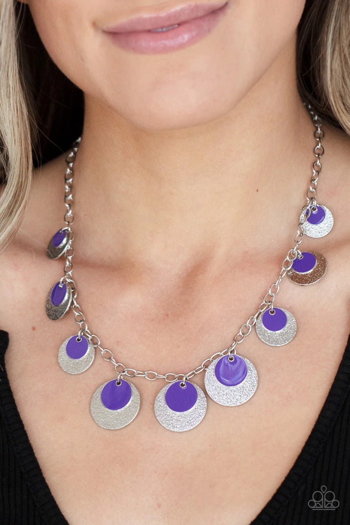 A stunning array of sparkling textured silver discs layered with Amethyst Orchid accent discs, fans out across the collar for a show-stopping cosmic display. Features an adjustable clasp closure.  Sold as one individual necklace. Includes one pair of matching earrings.