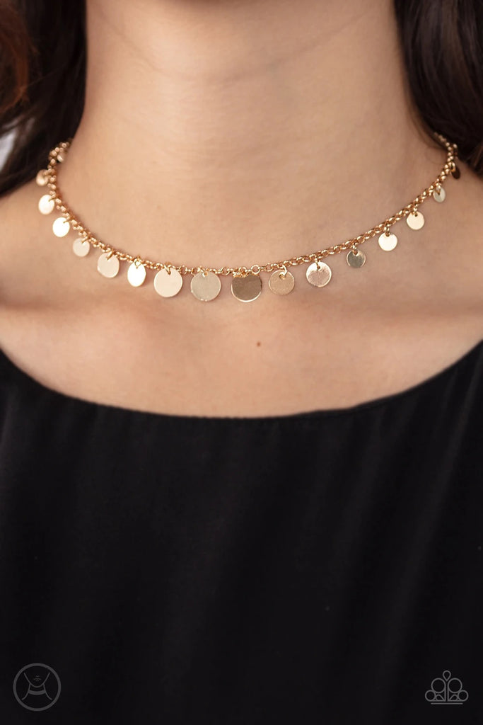 Gradually increasing in size at the center, shiny gold discs cascade from a classic gold chain, creating a shimmery fringe around the neck. Features an adjustable clasp closure.  Sold as one individual choker necklace. Includes one pair of matching earrings.