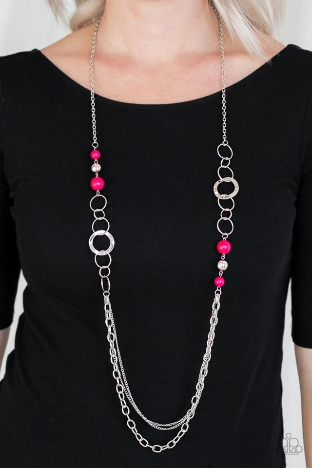 Vivacious pink beads, shiny silver beads, and glistening silver hoops give way to mismatched silver chains for a whimsical look. Features an adjustable clasp closure. Sold as one individual necklace. Includes one pair of matching earrings.