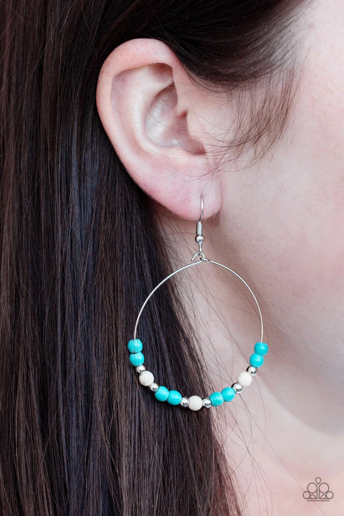 Dainty silver beads, refreshing turquoise, and earthy white stone beads slide along a dainty silver hoop for a seasonal look. Earring attaches to a standard fishhook fitting.  Sold as one pair of earrings.