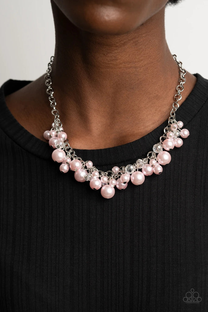 A collection of bubbly pink pearls and glittery crystal-like beads swing from the bottom of a chunky silver chain, creating an elegantly clustered fringe below the collar. Features an adjustable clasp closure.  Sold as one individual necklace. Includes one pair of matching earrings.