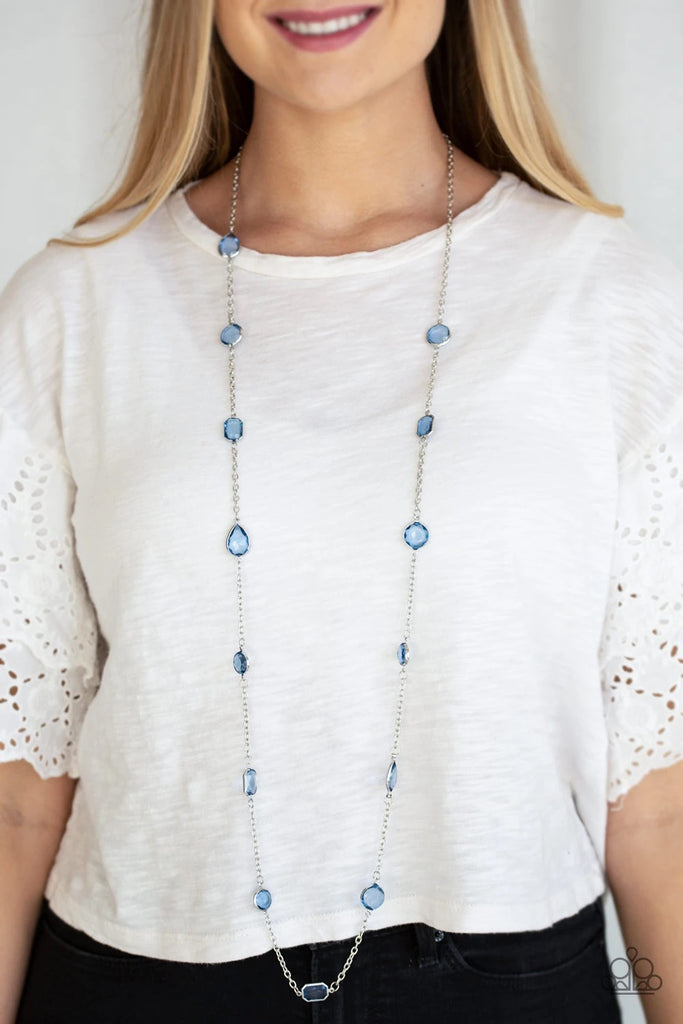 Featuring sleek silver fittings, an array of glassy Blue Depths gemstones trickle along a shimmery silver chain for a glamorous look. Features an adjustable clasp closure.  Sold as one individual necklace. Includes one pair of matching earrings.