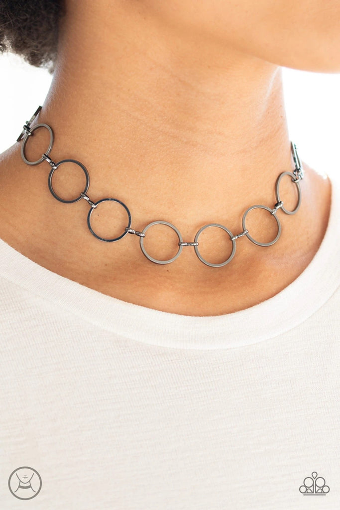 Glistening gunmetal hoops link around the neck for a casual look. Features an adjustable clasp closure.  Sold as one individual choker necklace. Includes one pair of matching earrings.