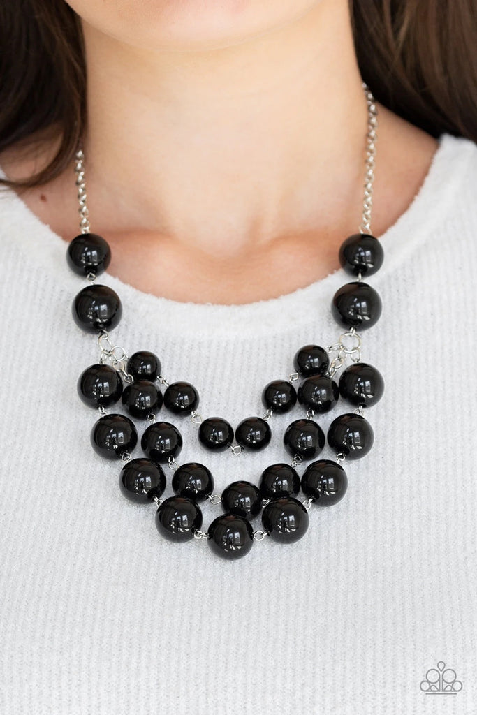 Three strands of bubbly black beads cascade below the collar, creating colorful layers. Features an adjustable clasp closure.  Sold as one individual necklace. Includes one pair of matching earrings.