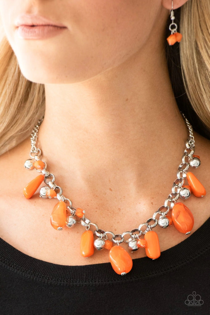 Featuring polished and cloudy finishes, a collection of Turmeric faux rocks dance from the bottom of a bold silver chain. Classic silver beads trickle between the colorful beading, adding a metallic shimmer to the whimsical fringe. Features an adjustable clasp closure.  Sold as one individual necklace. Includes one pair of matching earrings.  