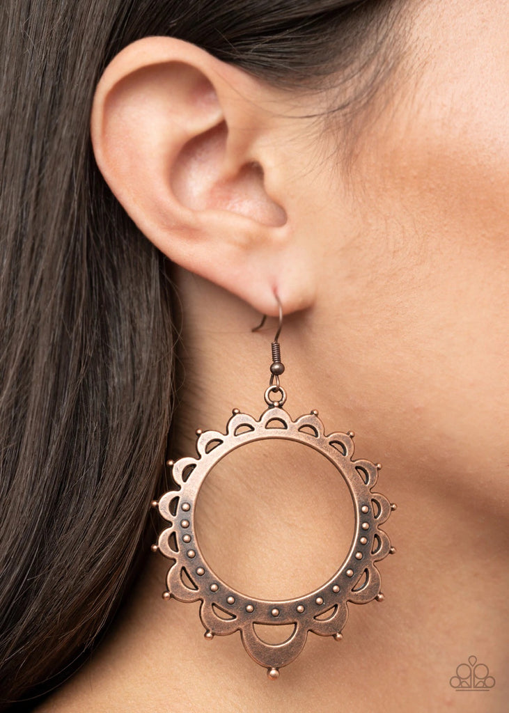 Studded petal-like frames radiate out from an antiqued copper hoop, coalescing into a whimsical sunburst. Earring attaches to a standard fishhook fitting.  Sold as one pair of earrings.