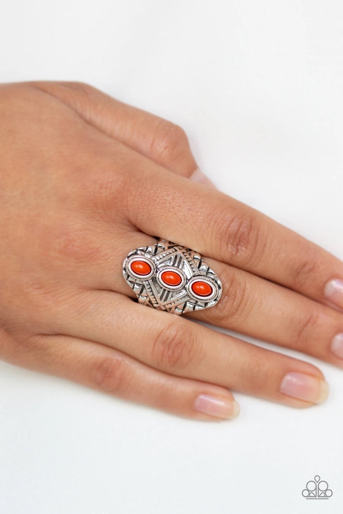 Three dainty orange beads stack along the center of an ornate silver frame embossed in shimmery geometric patterns for a bold tribal look. Features a stretchy band for a flexible fit.  Sold as one individual ring.  