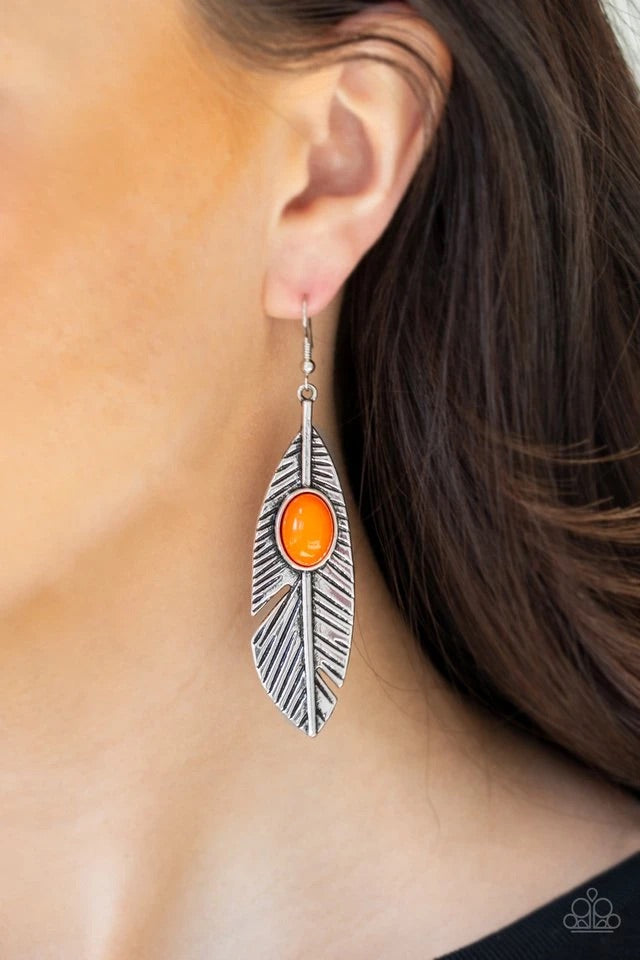 A vibrant orange bead is pressed into a shimmery silver feather frame radiating with lifelike textures for a colorful flair. Earring attaches to a standard fishhook fitting.  Sold as one pair of earrings.