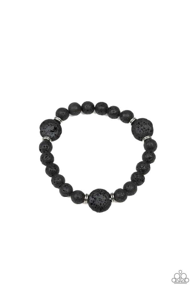 Infused with dainty silver rings, a collection of earthy black lava rock beads are threaded along a stretchy band around the wrist for a seasonal look.  Sold as one individual bracelet.