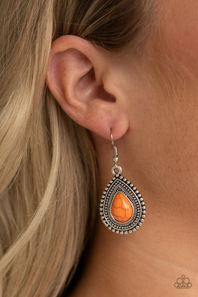 Chiseled into a tranquil teardrop, a vivacious orange stone is pressed into the center of a studded silver teardrop frame for a seasonal flair. Earring attaches to a standard fishhook fitting.  Sold as one pair of earrings.  