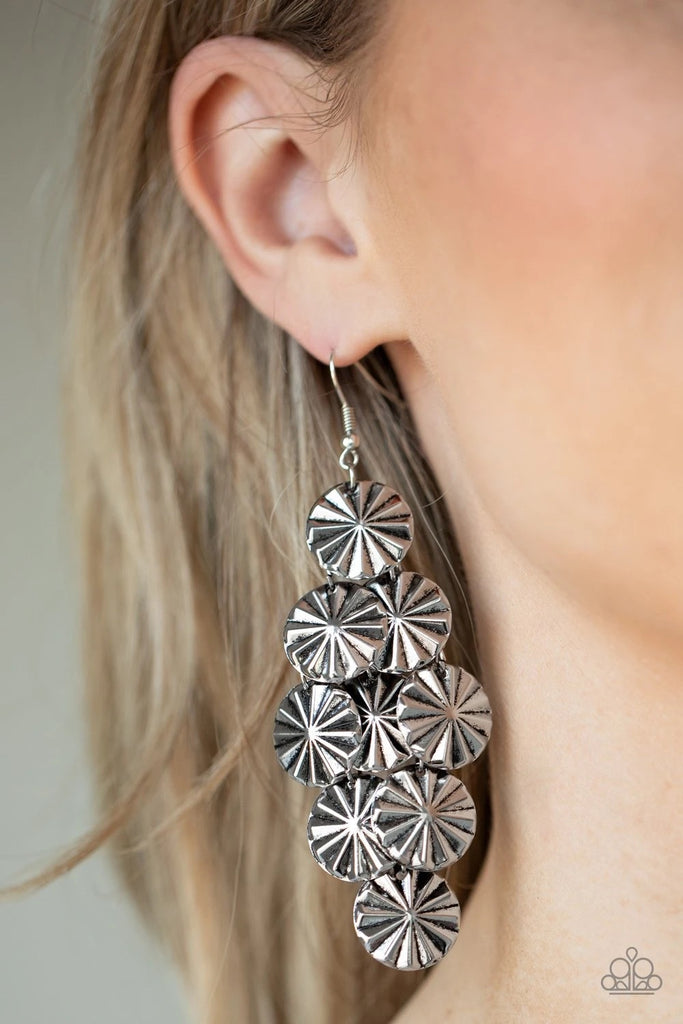 Creased in star-like patterns, antiqued silver discs attach to a silver netted backdrop, linking into an edgy lure. Earring attaches to a standard fishhook fitting.  Sold as one pair of earrings.