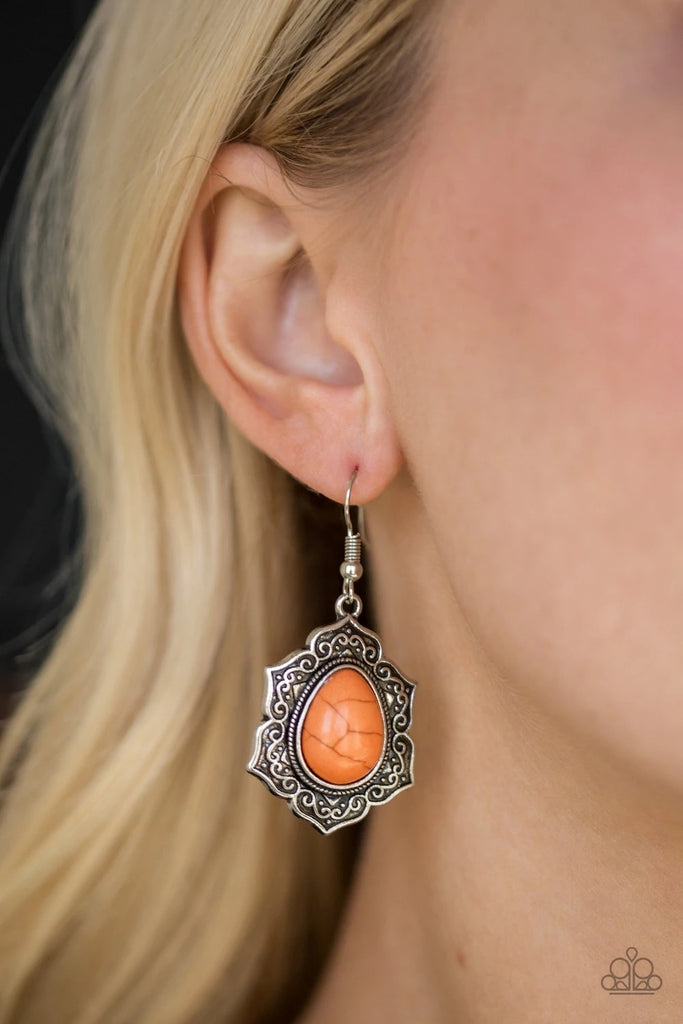 Decorative silver petals spin around an earthy orange stone center for a seasonal look. Earring attaches to standard fishhook fitting.  Sold as one pair of earrings.