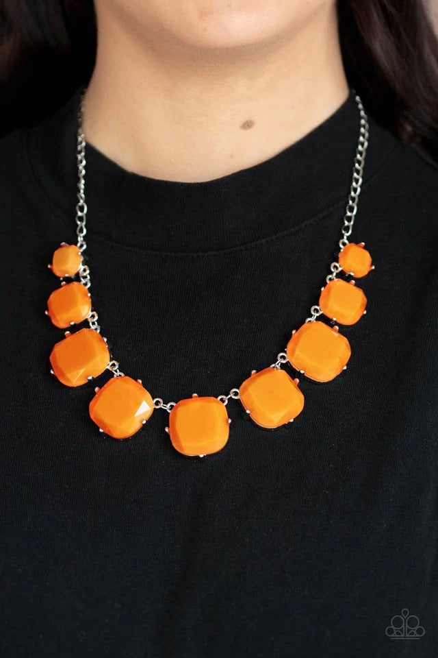 Encased in pronged silver fittings, faceted Marigold beads gradually increase in size as they link below the collar, creating a flamboyant pop of color. Features an adjustable clasp closure.  Sold as one individual necklace. Includes one pair of matching earrings.  