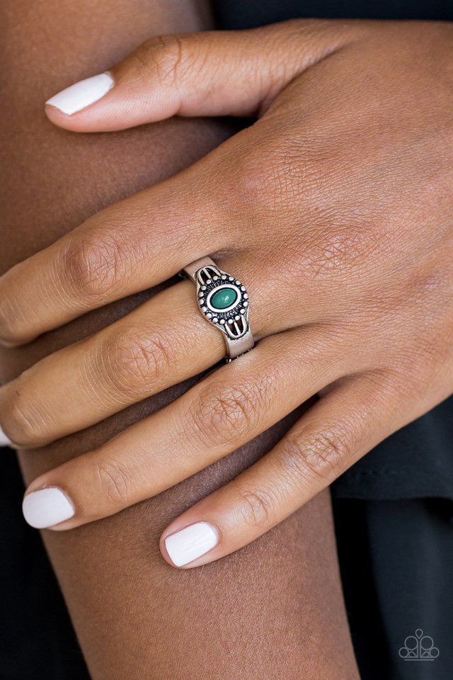 A refreshing green bead is pressed into the center of a dainty silver band radiating with tribal inspired textures for a seasonal look. Features a dainty stretchy band for a flexible fit.  Sold as one individual ring.