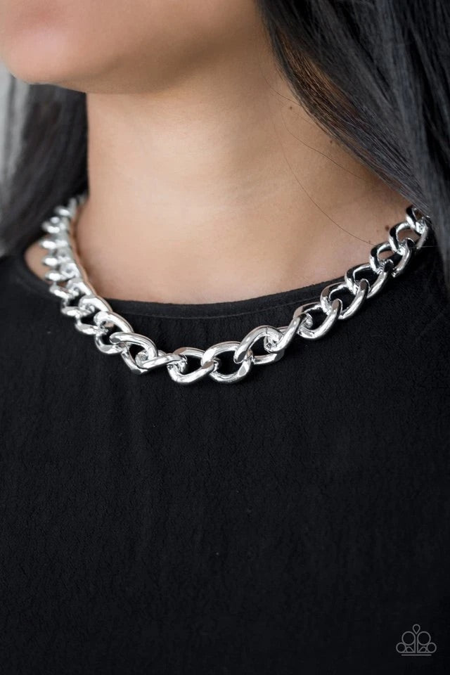 Brushed in a high-sheen shimmer, a bold silver chain drapes below the collar in an edgy industrial fashion. Features an adjustable clasp closure.  Sold as one individual necklace. Includes one pair of matching earrings.