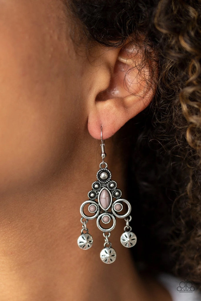 Floral stamped discs swing from the bottom of an ornate silver frame radiating with neutral gray stones and studded silver accents for a seasonal look. Earring attaches to a standard fishhook fitting.  Sold as one pair of earrings.