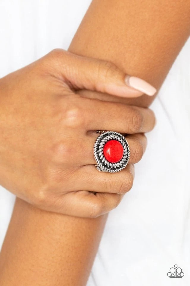 A smooth red stone is pressed into an antiqued silver frame radiating with twisted rope-like textures for an artisan inspired look. Features a stretchy band for a flexible fit. Sold as one individual ring.