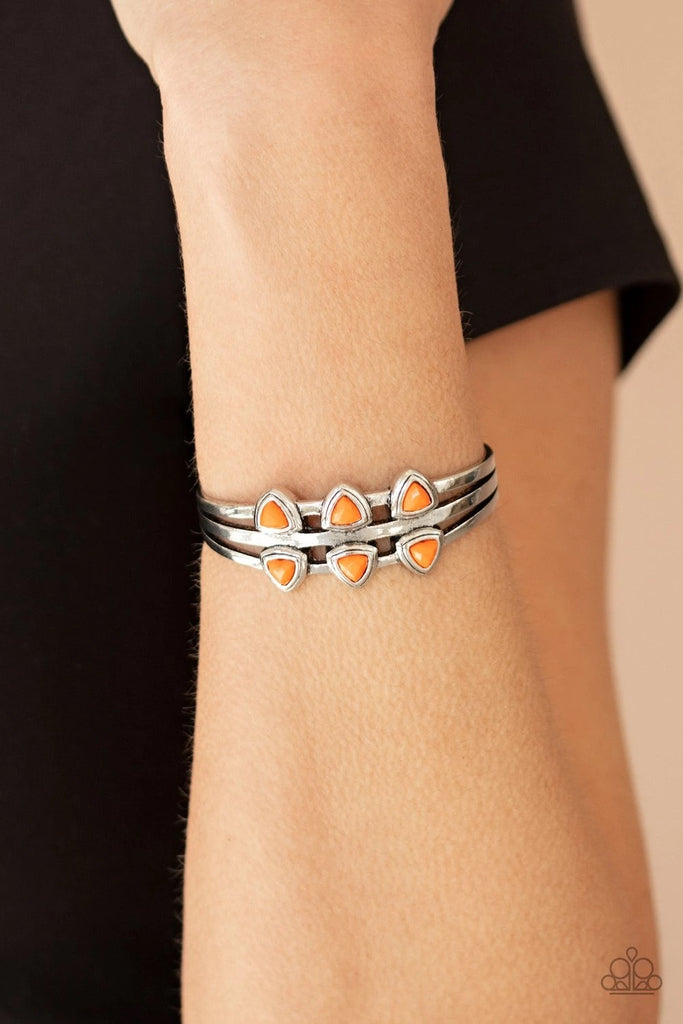 Rows of faceted Orange Peel triangle beads are pressed into the top of a layered silver cuff, creating a colorful centerpiece.  Sold as one individual bracelet.