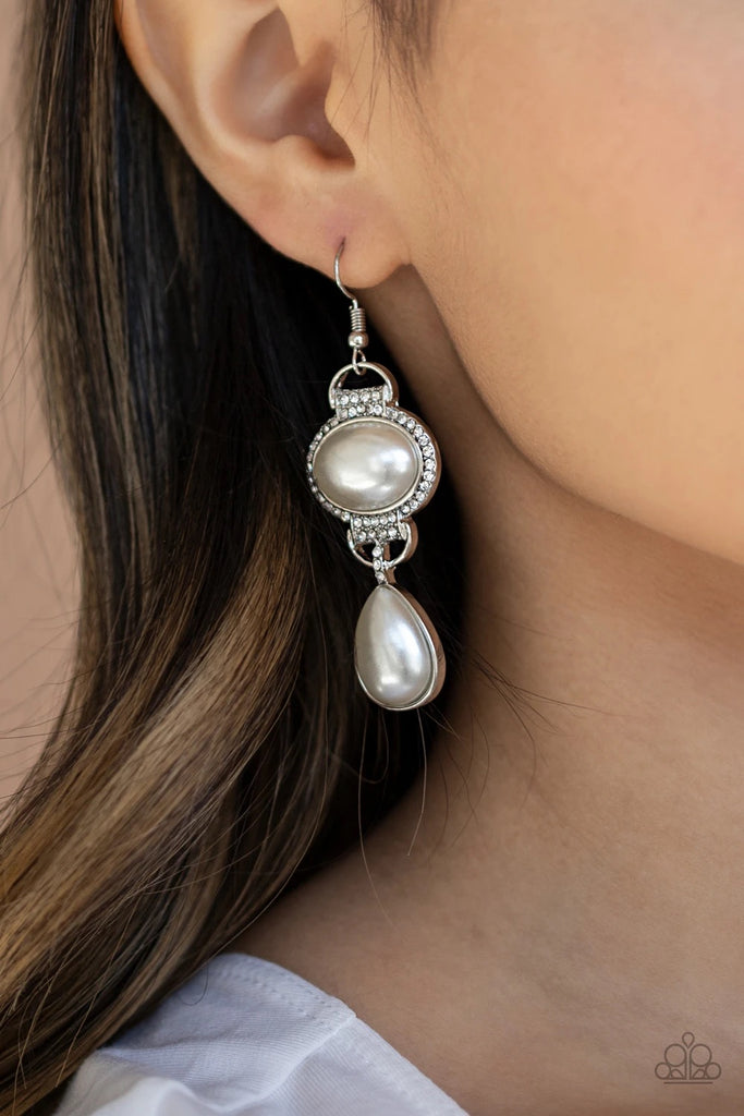 A pearly white teardrop bead is suspended from the bottom of an oval pearly bead bordered in icy white rhinestones, creating a timeless lure. Earring attaches to a standard fishhook fitting.  Sold as one pair of earrings.  