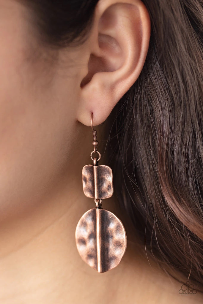 Brushed in an antiqued shimmer, a hammered square and oval copper frame have been threaded along a dainty rod, creating a handcrafted lure. Earring attaches to a standard fishhook fitting.  Sold as one pair of earrings.