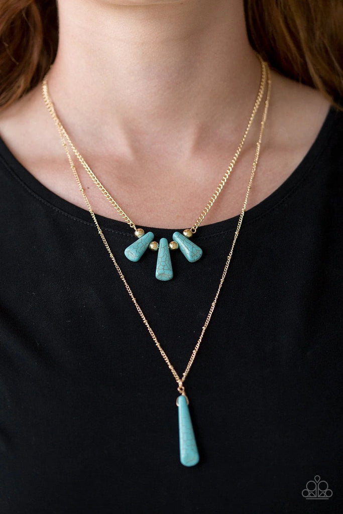 Chiseled into flared teardrop shapes, a dainty fringe of turquoise stones and golden beads gives way to a large stone pendant, creating earthy layers down the chest. Features an adjustable clasp closure.  Sold as one individual necklace. Includes one pair of matching earrings.