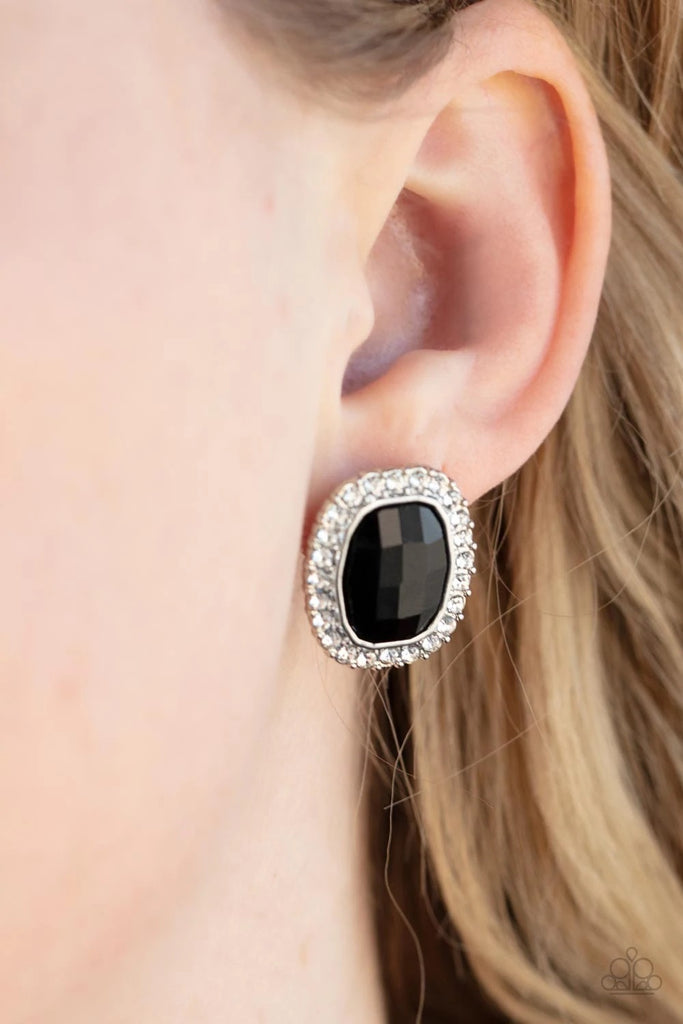 A faceted black gem is pressed into a shimmery silver frame radiating with glassy white rhinestones for a timeless fashion. Earring attaches to a standard post fitting.  Sold as one pair of post earrings.
