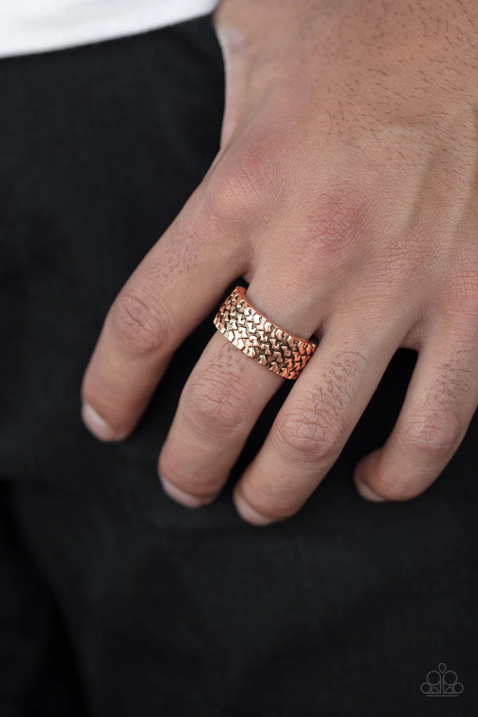 Embossed in a tactile tread-like pattern, a glistening copper band curls around the finger for an edgy look. Features a stretchy band for a flexible fit.  Sold as one individual ring.