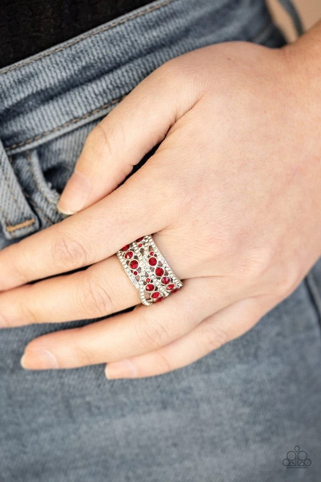 A collection of fiery red and glassy white rhinestones scatter across the finger, layering into a refined stacked centerpiece. Features a stretchy band for a flexible fit.  Sold as one individual ring.