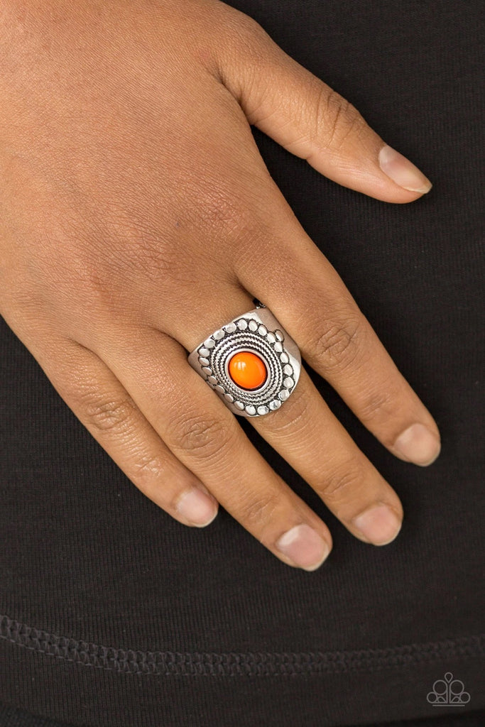 A vivacious orange bead is pressed into the center of a thick band radiating with dotted and rope-like patterns for a seasonal look. Features a stretchy band for a flexible fit.  Sold as one individual ring.