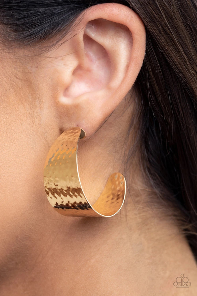 Delicately hammered in a shimmery finish, a flat gold frame curls into a curvy hoop for a chic finish. Earring attaches to a standard post fitting. Hoop measures approximately 1 1/2" in diameter.  Sold as one pair of hoop earrings.
