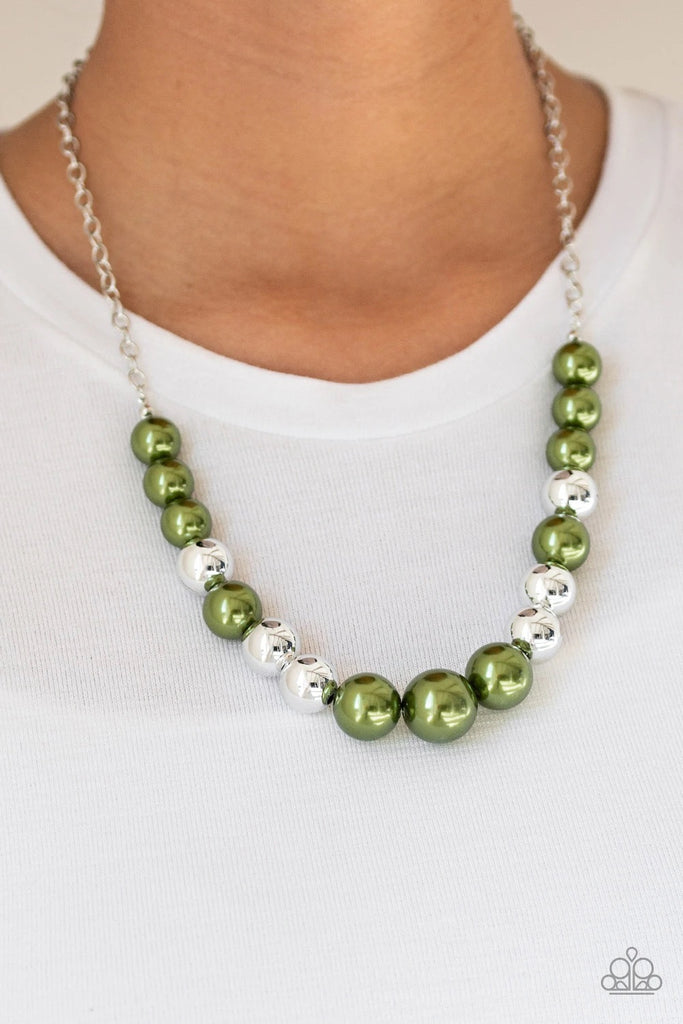 A collection of oversized silver and pearly green beads drape across the chest for a refined look. Features an adjustable clasp closure.  Sold as one individual necklace. Includes one pair of matching earrings.