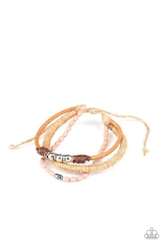 Infused with wooden Rose Tan beads and mismatched silver accents, earthy strands of twine and suede cording layer across the wrist for a seasonal flair. Features an adjustable sliding knot closure.  Sold as one individual bracelet.