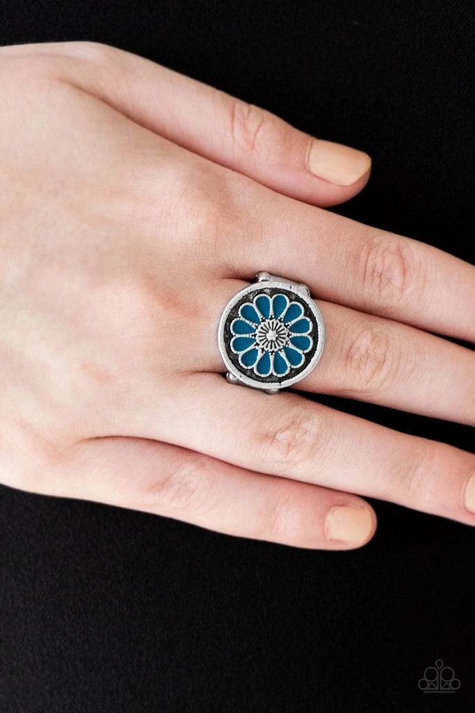Brushed in an antiqued shimmer, refreshing blue petals spin into a whimsical floral pattern atop the finger. Features a stretchy band for a flexible fit.  Sold as one individual ring.