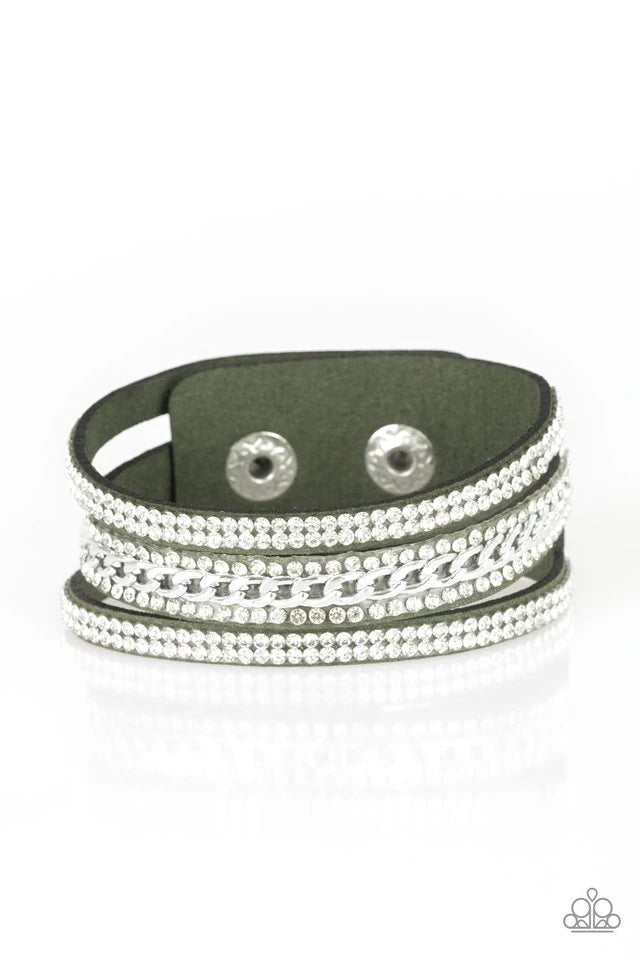 Rows of glassy white rhinestones and a shimmery silver chain are encrusted along green suede bands for a sassy look. Features an adjustable snap closure.  Sold as one individual bracelet.