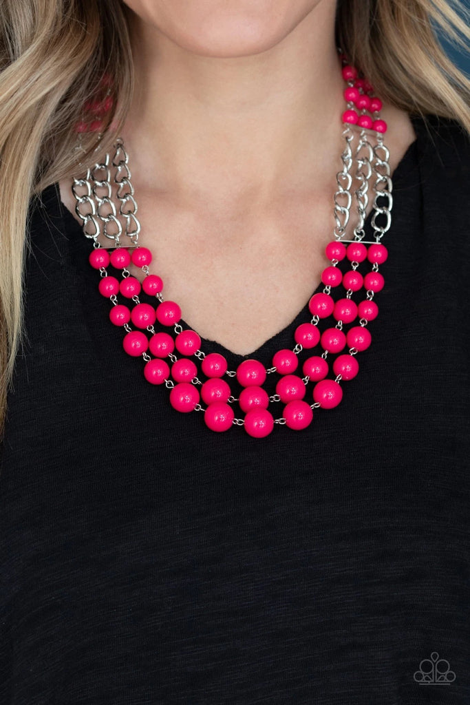 Sections of thick silver chains and bubbly pink beaded rows layer below the collar, creating statement-making layers. Features an adjustable clasp closure.  Sold as one individual necklace. Includes one pair of matching earrings.