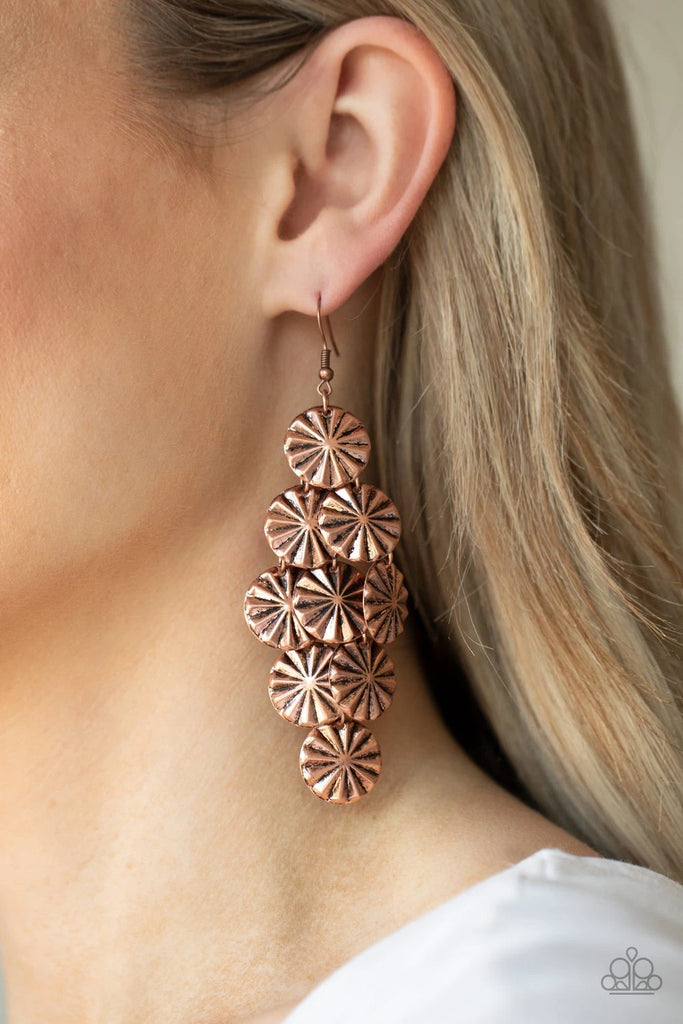 Creased in star-like patterns, antiqued copper discs attach to a copper netted backdrop, linking into an edgy lure. Earring attaches to a standard fishhook fitting.  Sold as one pair of earrings.