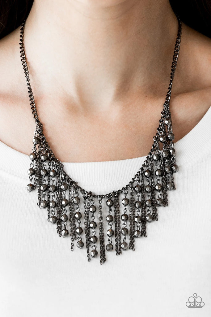 Strands of faceted gunmetal beads and glistening gunmetal chains stream from a matching gunmetal chain, creating an edgy fringe below the collar. Features an adjustable clasp closure.  Sold as one individual necklace. Includes one pair of matching earrings.