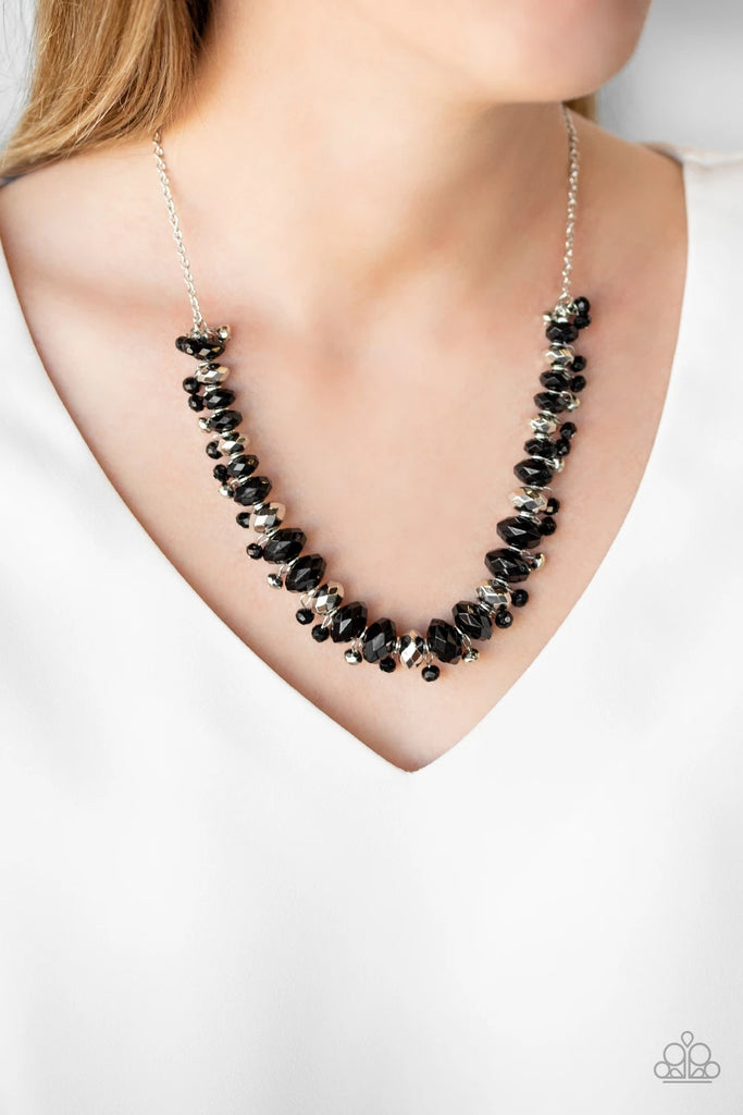 Faceted silver and black beads are threaded along an invisible wire below the collar. Dainty silver and black beads dangle from the colorful combination, creating an edgy fringe. Features an adjustable clasp closure.  Sold as one individual necklace. Includes one pair of matching earrings.