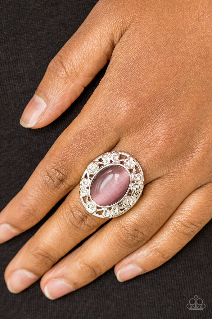 Shimmery floral-like filigree swirls around a glowing purple moonstone center, creating a whimsical centerpiece atop the finger. Features a stretchy band for a flexible fit.  Sold as one individual ring.