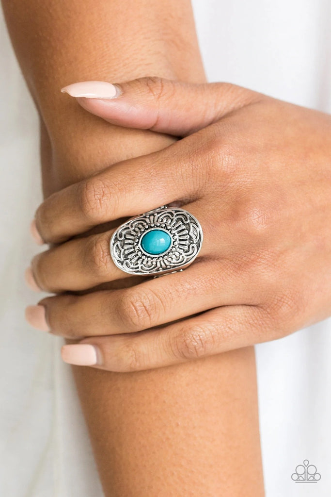 A refreshing blue bead is pressed into the center of a silver frame embossed in glistening floral details for a seasonal flair. Features a stretchy band for a flexible fit.  Sold as one individual ring.