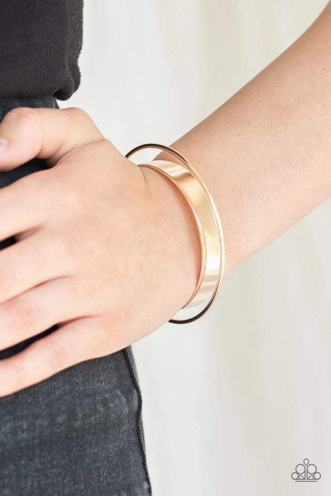 Featuring rose gold beaded fittings, a dainty rose gold bar arcs over a flat rose gold cuff and is fitted in place for a sleek, modern look.  Sold as one individual bracelet.