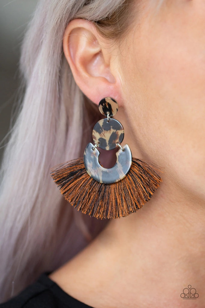 Featuring a cheetah-like print, mismatched glassy frames link into a retro lure. A fan of shiny black and brown thread flares from the bottom, creating a flirtatious fringe. Earring attaches to a standard post fitting.  Sold as one pair of post earrings.